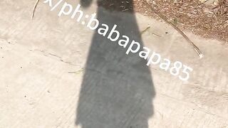 sissy in red bottom high heels and white hollow top exposes herself and pees below highway bridge